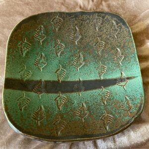 Pottery plate, irregular and unique edging.